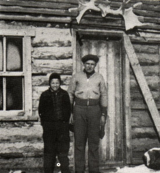 Teacher Kirt Newman and student Dennis Anderson in front of Louis Pelchat's store.