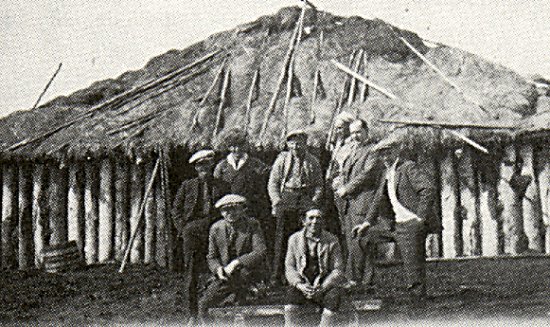A settler's barn, with a group of Big River residents.