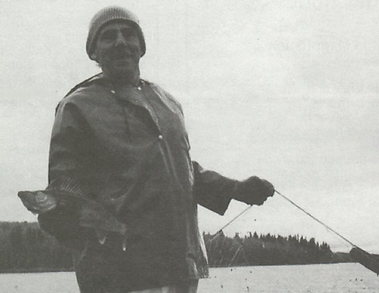 Stewart Thompson outside brother Jack's Camp with a Walleye Pike Pickerel.