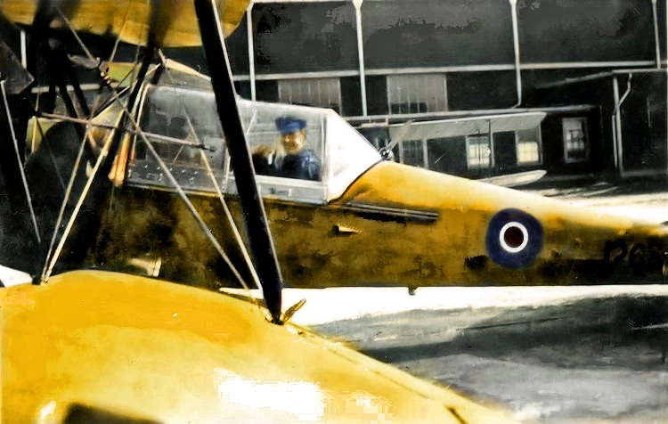 Lefty in cockpit of Tiger Moth aircraft.