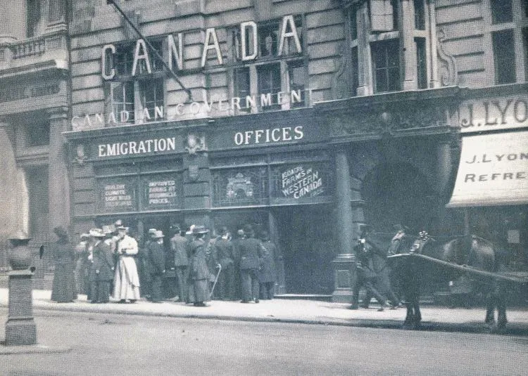 Crowd observing a working model of a Saskatchewan grain elevator.